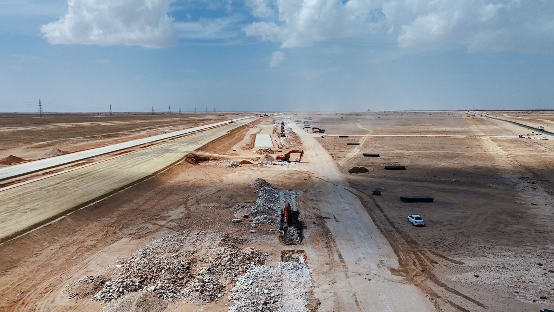 Earthworks and road construction on a desert industrial site